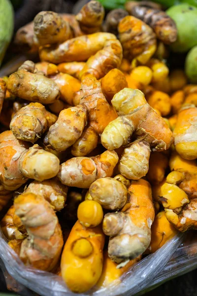 raw turmeric vegetables at vegetable store for sale at evening