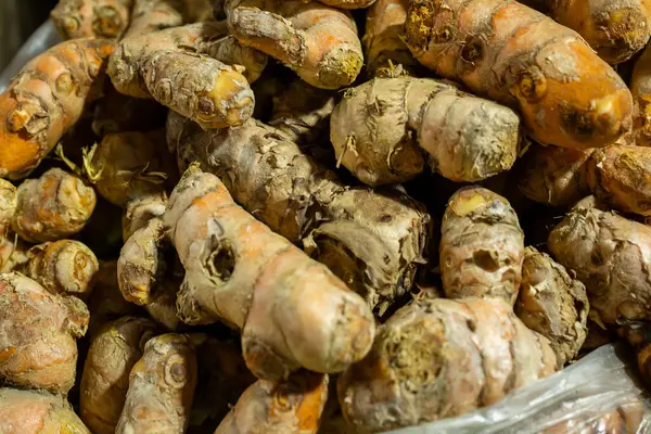 raw turmeric vegetables at vegetable store for sale at evening