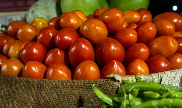 fresh red tomato at vegetable store for sale at evening