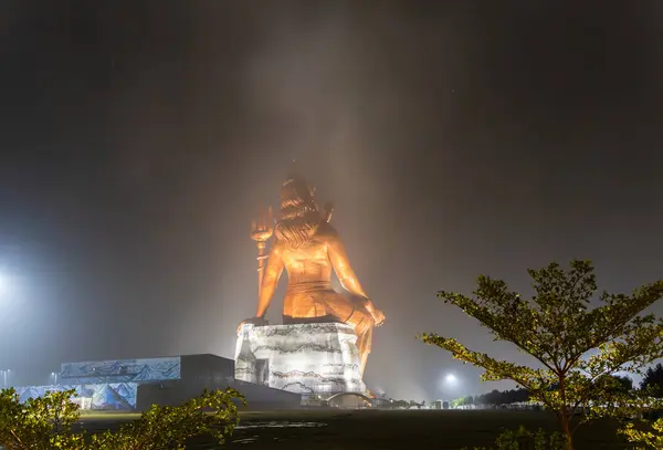 Stock image back view of hindu god lord shiva isolated statue at night from different angle image is taken at statue of belief nathdwara rajasthan india.