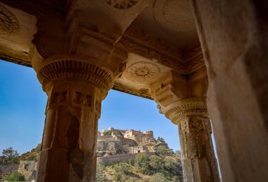 ancient fort ruins with bright blue sky from unique perspective at morning image is taken at Kumbhal fort kumbhalgarh rajasthan india. clipart