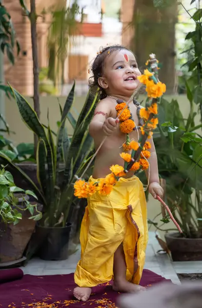 stock image Portrait of cute Indian boy dresses as lord rama with bow at outdoor with blurred background at day