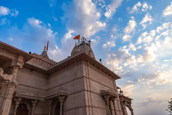 stock image artistic hindu temple with dramatic sunset sky at evening from unique perspective image is taken at Shri Yade Mata Pawan Dham temple jodhpur rajasthan india.