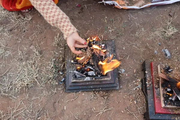 stock image offerings made to holy fire at hindu delubrum or Yagya prayers at day