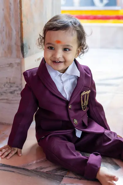 stock image cute indian toddler walking in suit with different facial expression at outdoor from flat angle