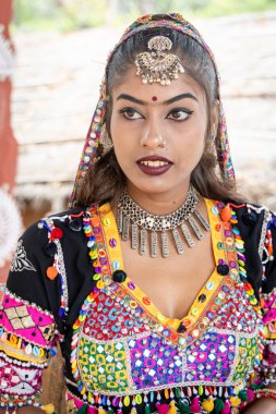 young indian girl in traditional rajasthani attire close up shots from different angle clipart