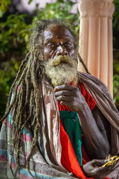 stock image indian old saint with dramatic presence with tresses hair and beard at evening