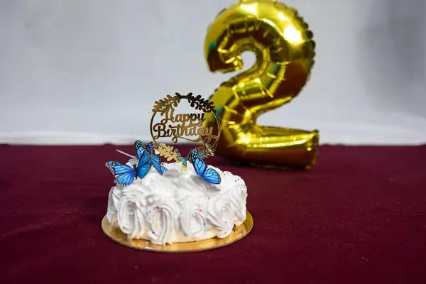 stock image Gorgeous White Cake at Second Birthday Party Indoors