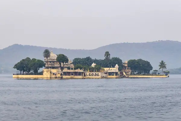 stock image artistic architecture at pristine lake with mountain background at morning image is taken at Udaipur rajasthan india.