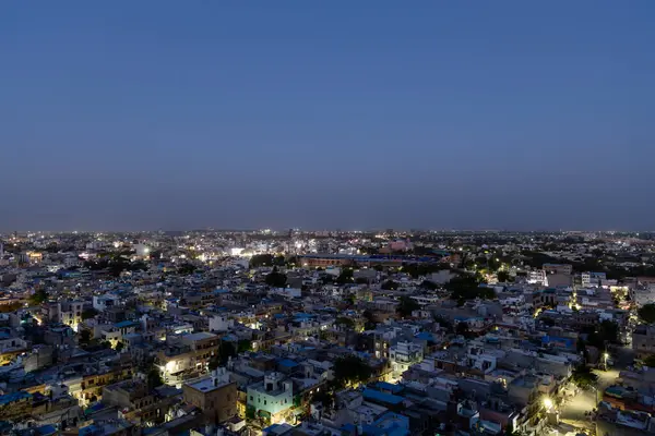 Stock image Crowded City dusk view with evening lighting from Mountain Peak at Dusk