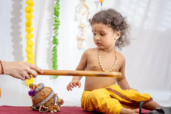 stock image little indian baby boy in holy hindu god kirshna attire at indoor