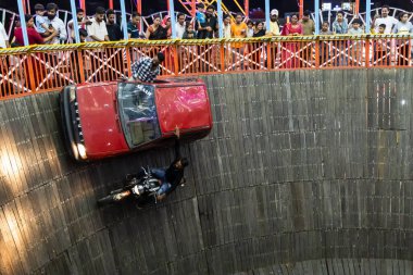 well of death or maut ka kuan show by car and bike stunt at evening video is taken at jodhpur local fair rajasthan india on Aug 19 2024. clipart