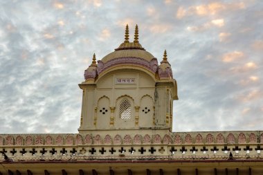 Sacred Hindu temple with its vibrant architecture and dramatic sky at evening from different angle image is taken at Kanak Bhawan temple in Ram Janmabhoomi Ayodhya Uttar Pradesh India. clipart