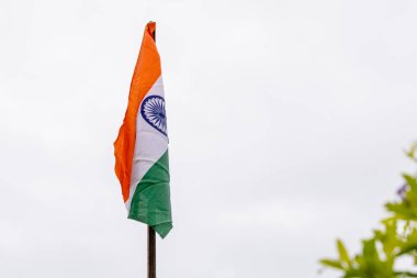 Waving Indian Tricolor Flag Against White Sky Background at Morning clipart