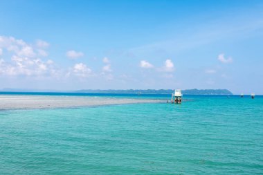 Pristine Coastal Scene with Clear Waters and Bright Sky image is taken at neil Island at Andaman and Nicobar Islands. clipart