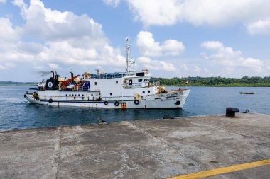 government passenger ship ferry docking at island jetty under clear morning sky image is taken at havelock island andaman and nicobar islands india on Nov 13 2024. clipart