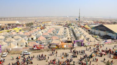 crowded temporary shelters at triveni sangam at mahakumbh festival image is taken at mahakumbh mela prayagraj uttar pradesh india on Feb 17 2025. clipart