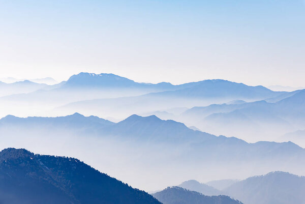 breathtaking mist covered mountain range at morning