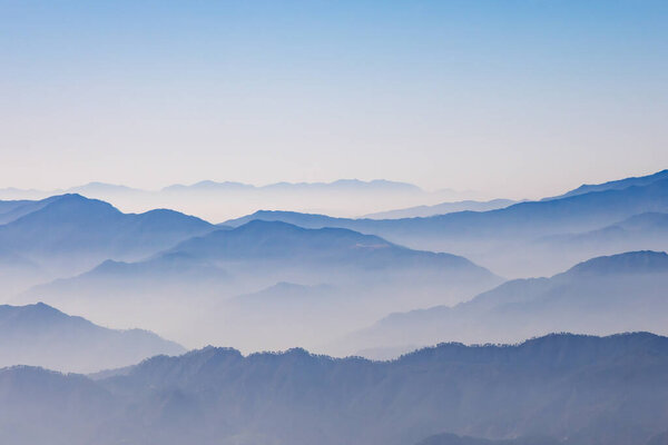 breathtaking mist covered mountain range at morning