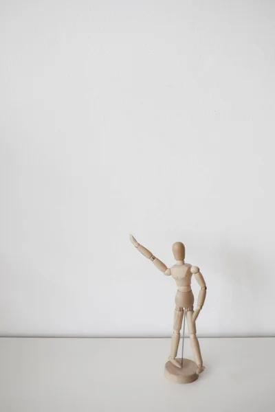 Wooden man on a white background. Copy space. Clean background