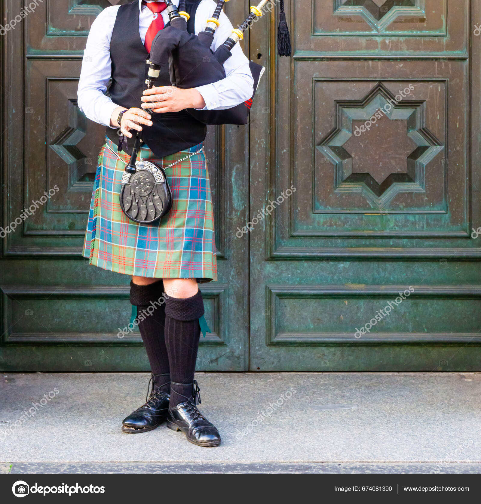 Front View Traditional Scottish Musician Playing Bagpipes Dressed