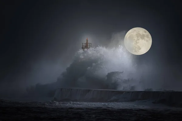 Stormy wave splash in a full moon night