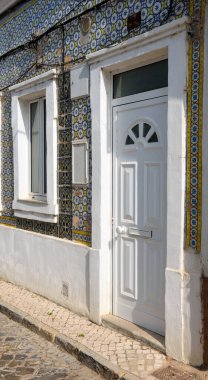 typical houses decorated with tiles (azulejos) in olhao algarve portugal