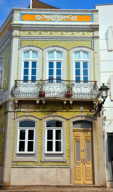 typical houses decorated with tiles (azulejos) in olhao algarve portugal