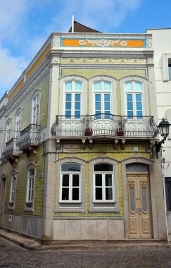 typical houses decorated with tiles (azulejos) in olhao algarve portugal