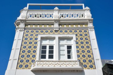 typical houses decorated with tiles (azulejos) in olhao algarve portugal