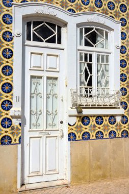 typical houses decorated with tiles (azulejos) in olhao algarve portugal
