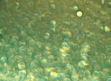 yeşil ve altın parıltılı arkaplan.