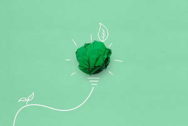 Creative idea and Innovation of environmental, Corporate Social Responsibility (CSR), eco-friendly business concept with crumpled green paper light bulb and environmental sketch on green background