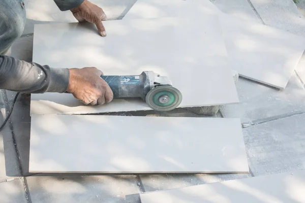 Worker Cutting Tile Using Angle Grinder Construction Site — Stock Photo, Image