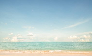 Seascape abstract beach background. calm sea and sky. Focus on sand foreground. vintage color tone.