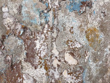 Old paint on the surface of an old concrete wall texture and background