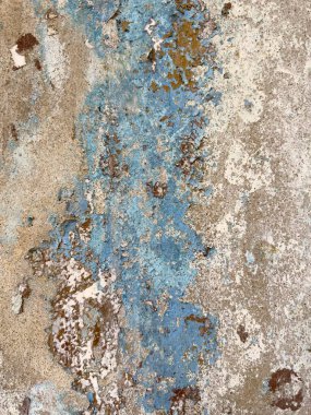 Old paint on the surface of an old concrete wall texture and background