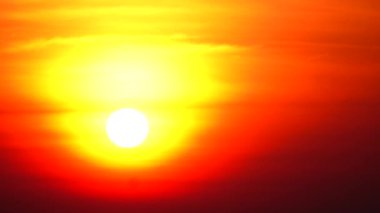 Bu çarpıcı yüksek çözünürlüklü video Güneş 'i yakından yakalar, yoğun kırmızı, portakal ve sarıları gösterir. Güneş, karanlık gökyüzünde büyük bir küre olarak belirir. 