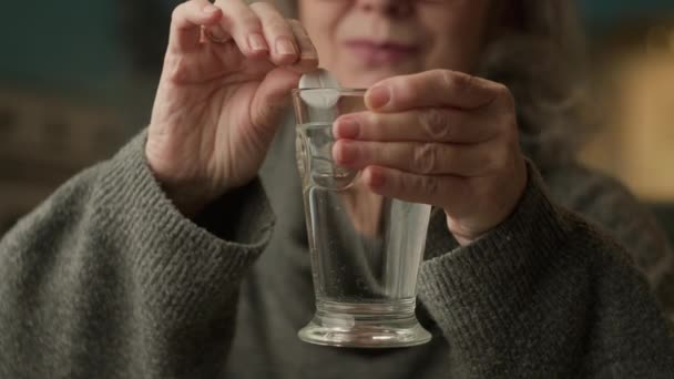 Elderly Female Hands Puts Pill Water Senior Female Taking Medicine — Stock Video
