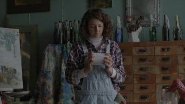 Artist Preparing Oil Paints. Female painter creating artworks in workshop. 4K