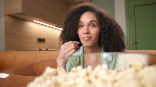 Woman Eats Popcorn Close Smiling Mixed Race Woman Enjoys Watching — Stok video