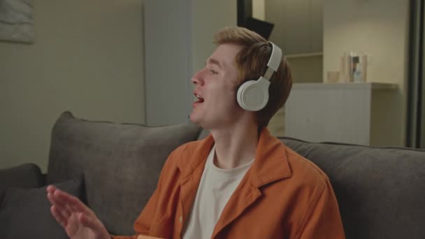 Man Listening Music Wireless Headphones Young Adult Enjoys Music Holding — Stock Video