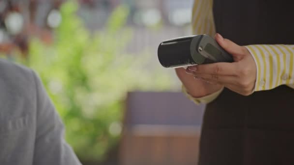 Effortless Payment Outdoors Hands Tap Smartphone Nfc Terminal Showcasing Convenience — Stock Video