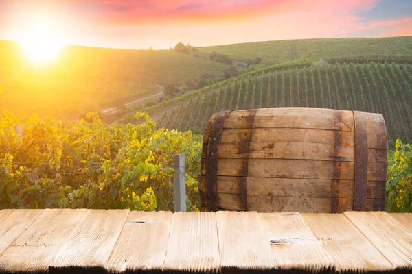 Red wine with barrel on vineyard in green Tuscany, Italy. High quality photo