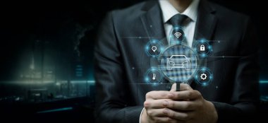 Smart car research concept. A man looks through a magnifying glass in a smart car app.
