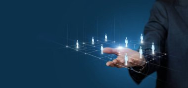 Hand shows human resources on a process flowchart on a blue background.