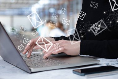 The concept of correspondence using a laptop in the office on a blurred background.