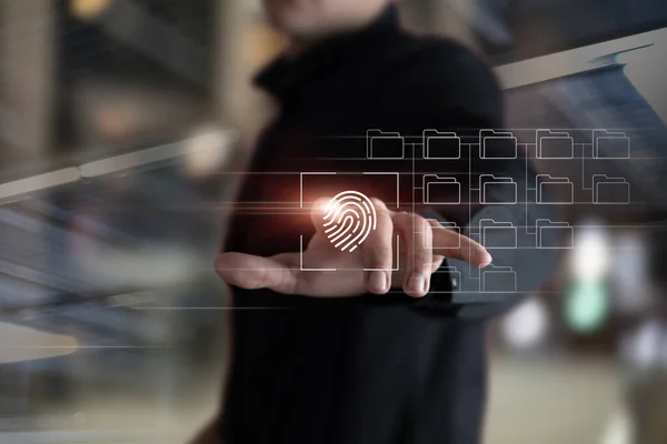 Businessman scanning fingerprint to open documents on virtual screen.