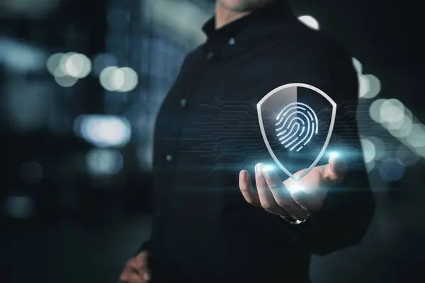 Concept of protection using fingerprint code. Shows a shield with a fingerprint inside.