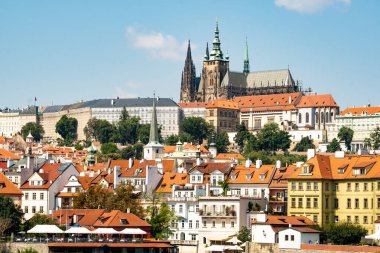 Prague Castle panorama, view from Smetanovo nabrezi over the Vltava river towards the Castle with Na kampe and other buildings in the foreground